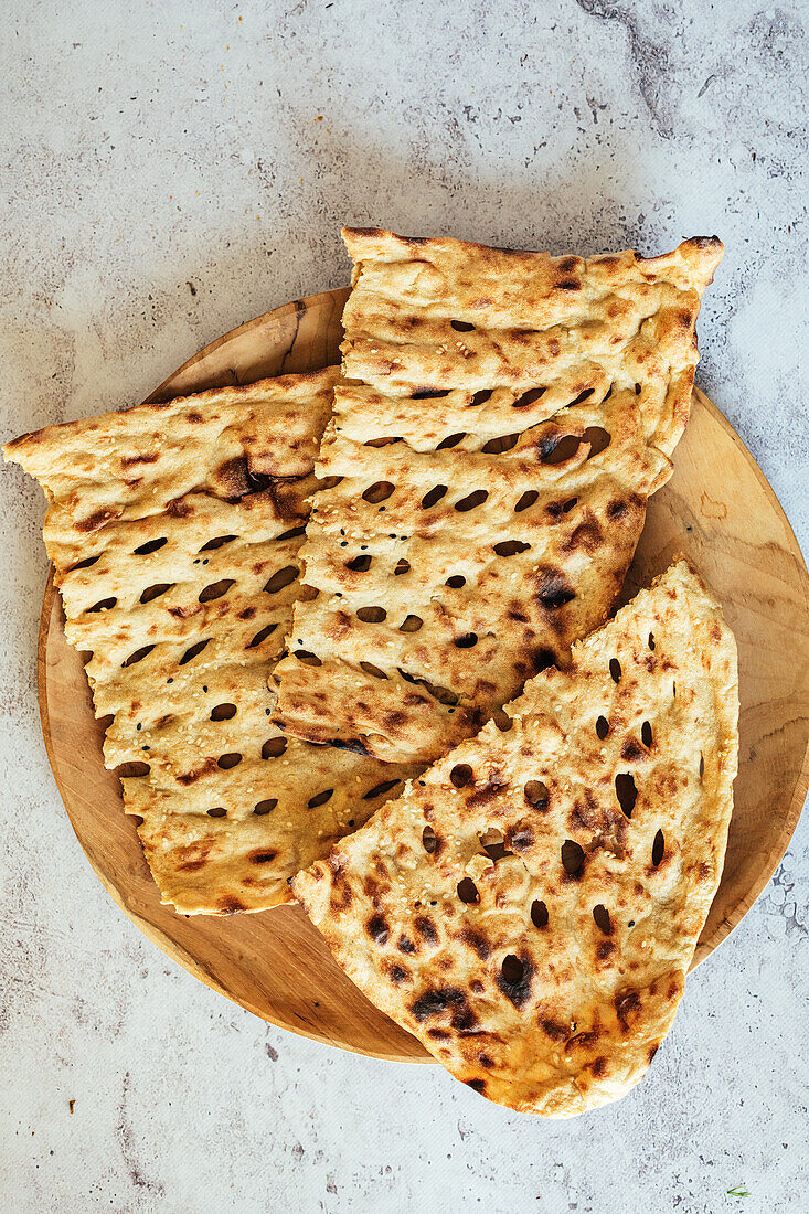 Sangak. A Persian (Iran) bread made with a sourdough starter and baked on a bed of small river stones in an oven