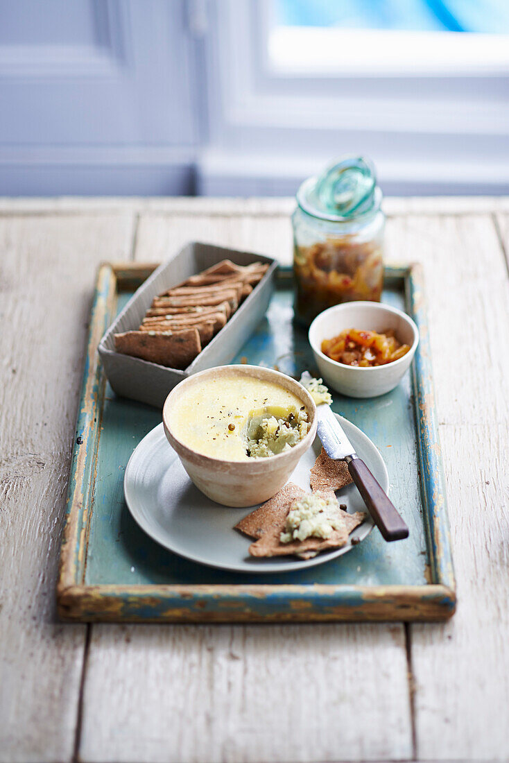 Potted Stilton served with rye pumpkin seed crackers and peach chili chutney