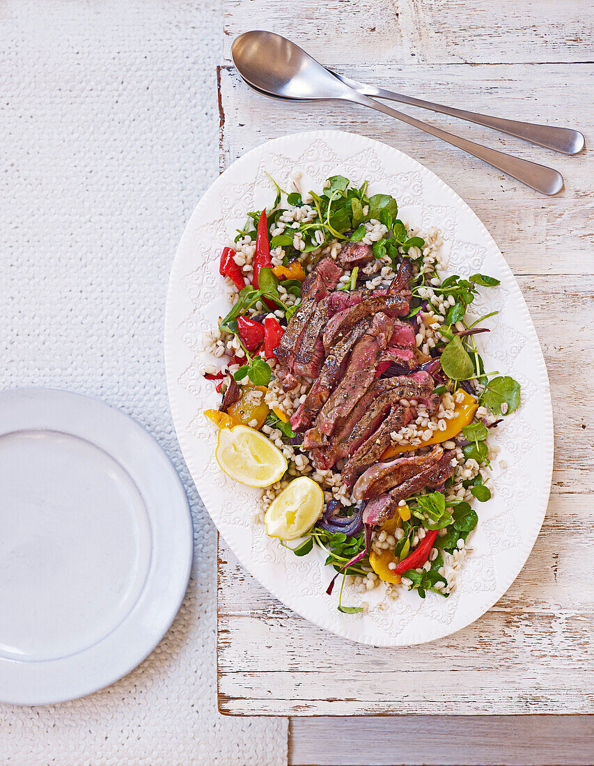 Salad with steak, roasted peppers, and pearl barley