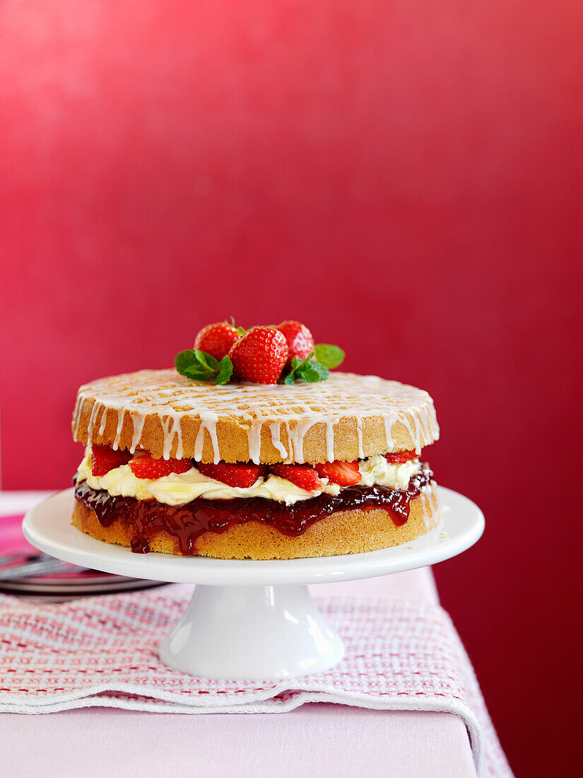 Afternoon tea cake with strawberries and mint