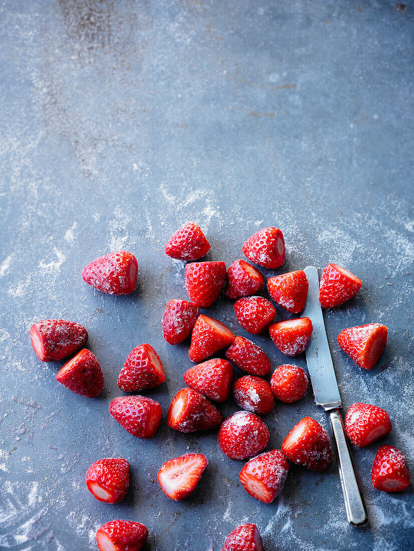 Frozen strawberries on a grey background