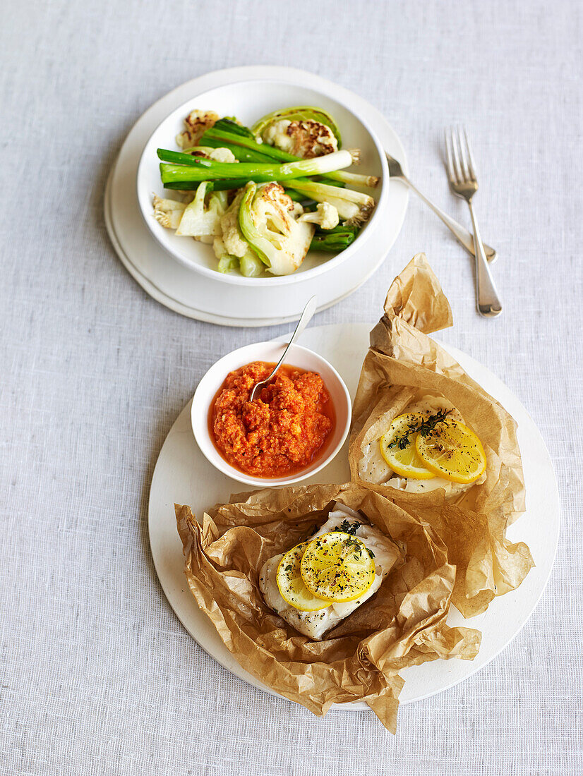 Fish parchment parcels with Romesco sauce and vegetables
