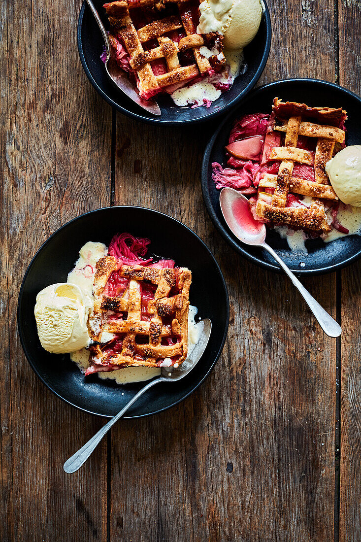 Rhubarb and apple pie with pastry lattice served with vanilla ice cream