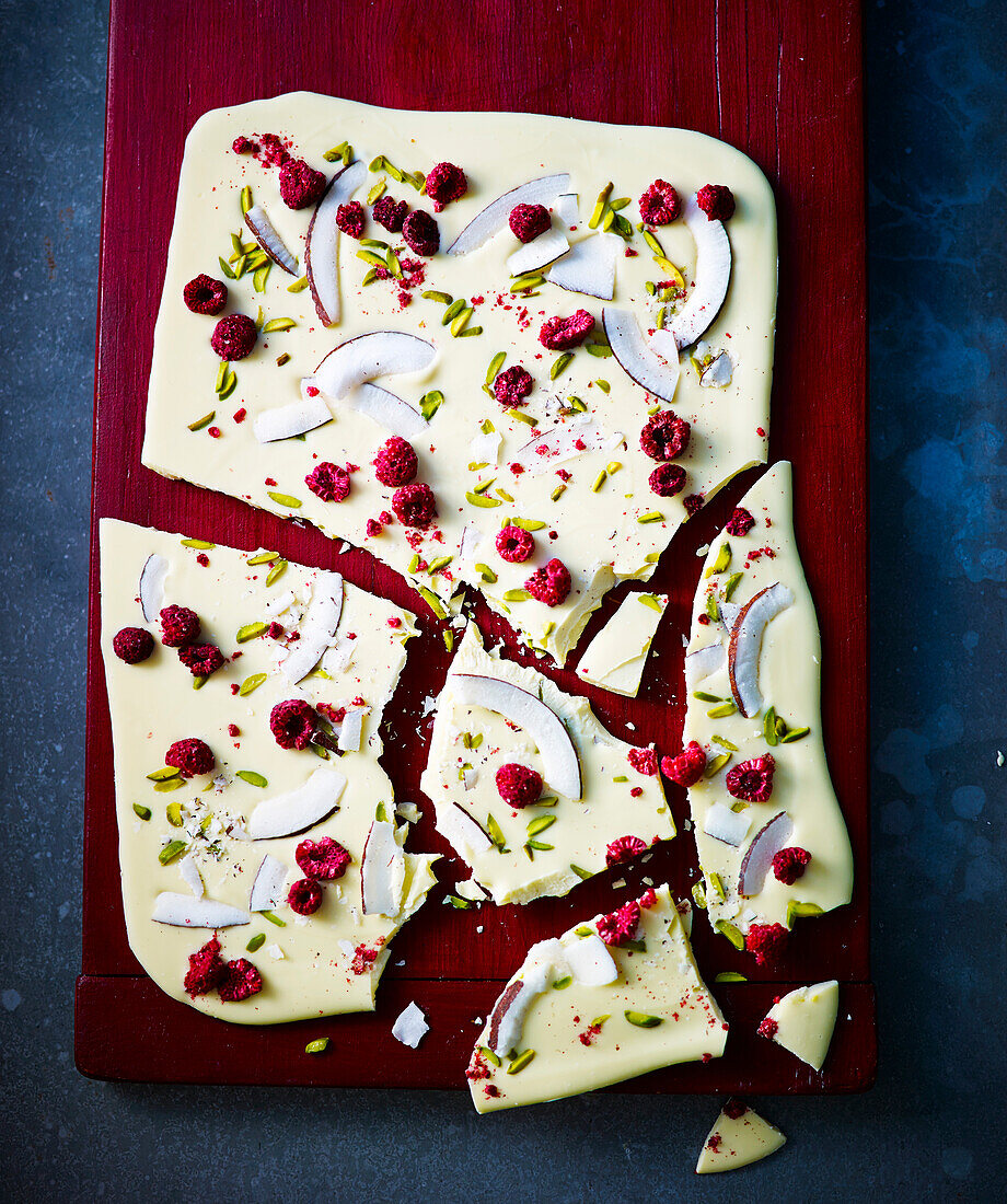 Broken white chocolate with raspberries, coconut and pistachios