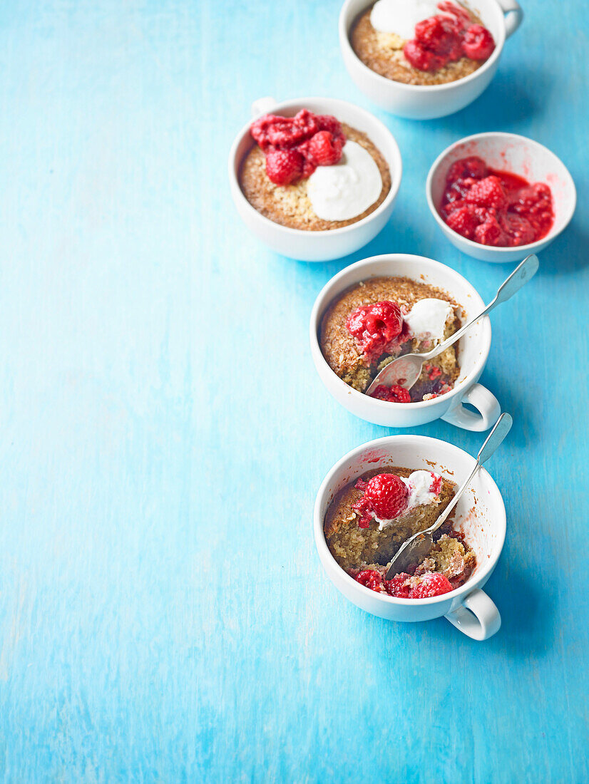 Hot coconut and raspberry puddings