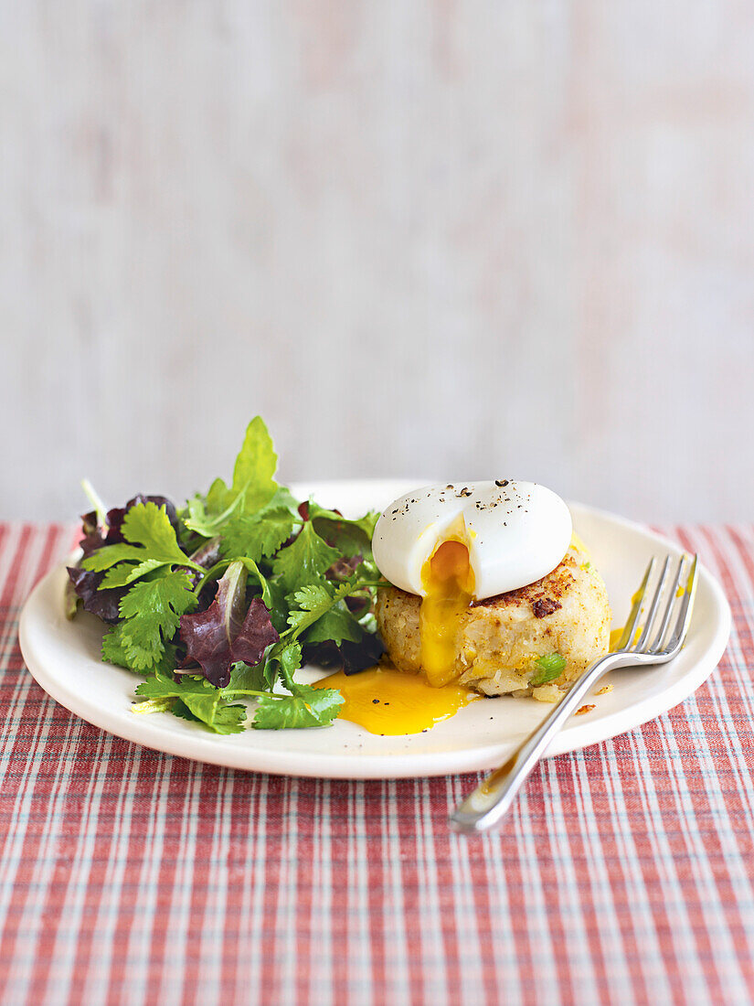 Spicy smoked fish cakes with herb salad and eggs