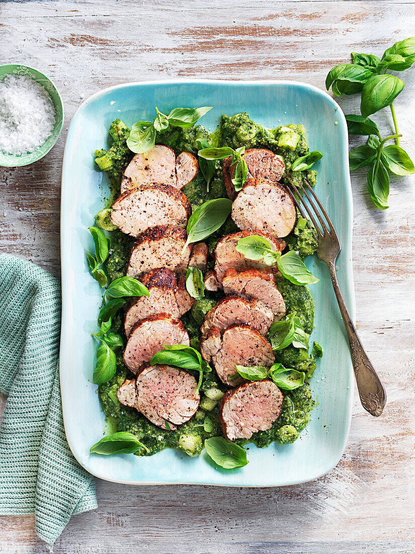 Ovenbaked pork fillet with pesto and basil