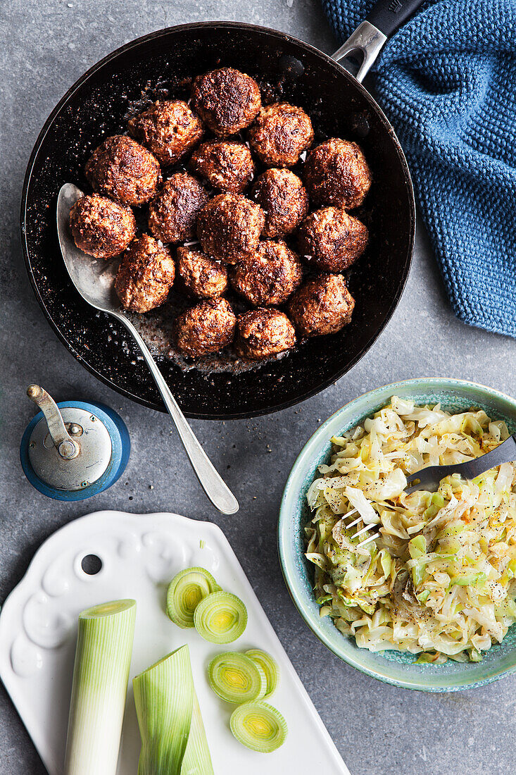 Meatballs and cabbage salad and leek