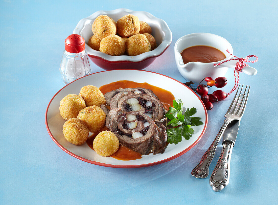 Deer roll with rose hip sauce and homemade croquette