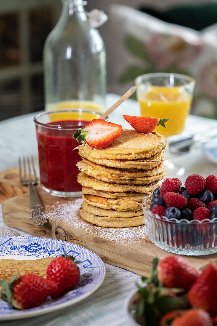 Banana oat pancakes with fresh berries for breakfast