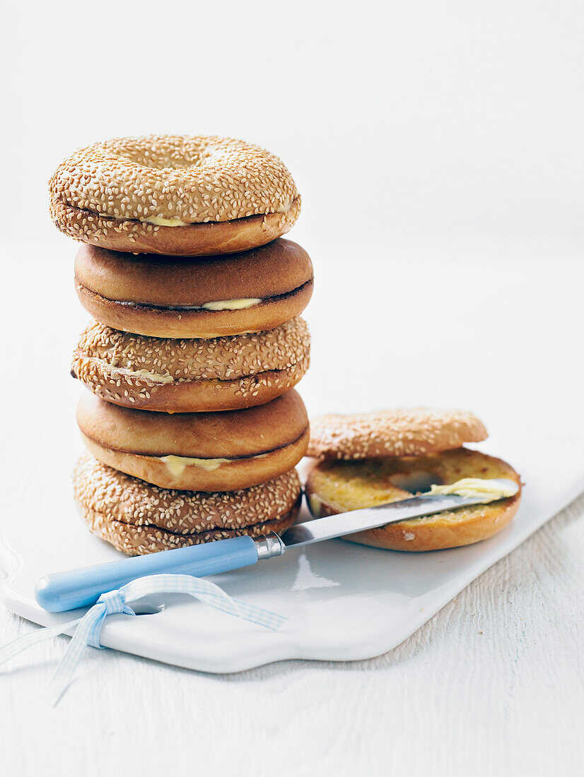 Bagels with butter, stacked