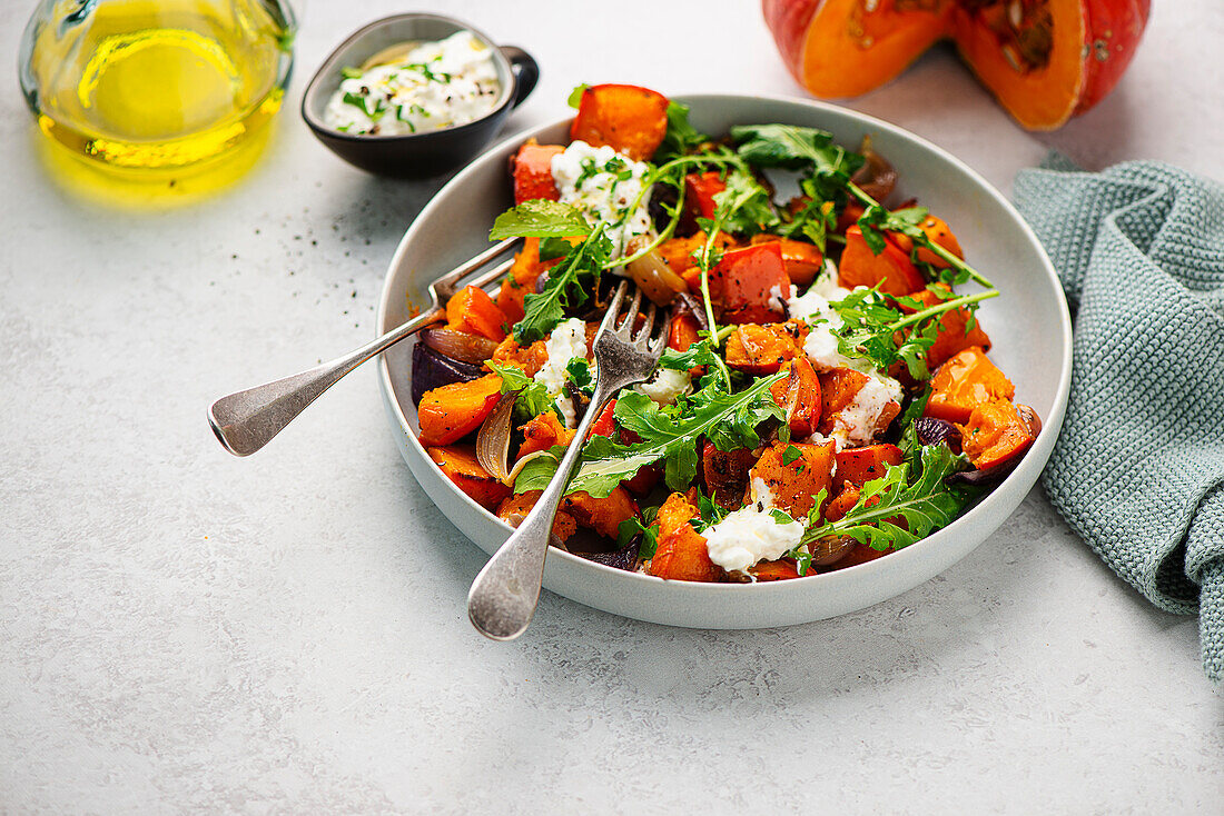 Pumpkin salad with rocket and feta sauce