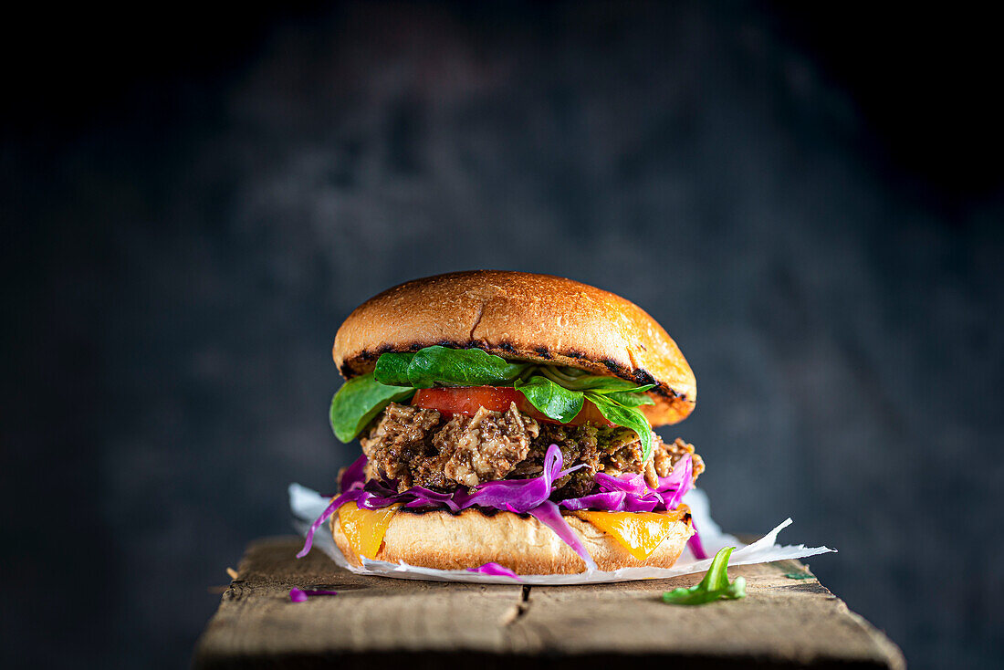 Grilled burger with pulled beef and red cabbage