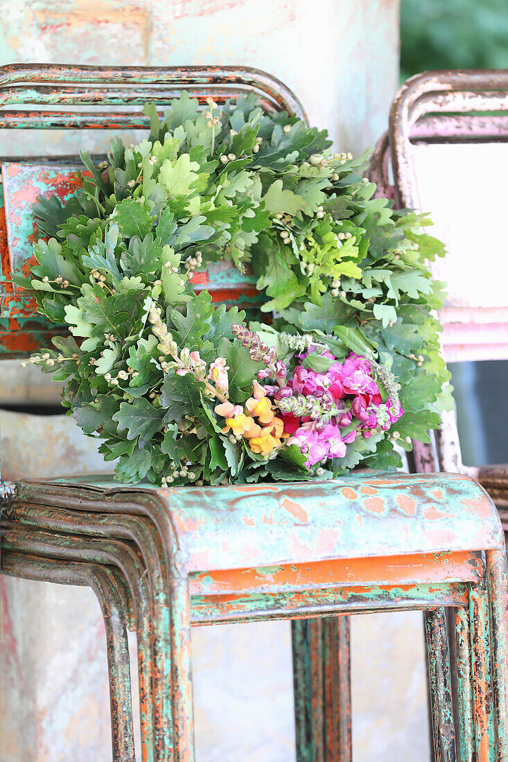 Oak leaf wreath with colorful flowers