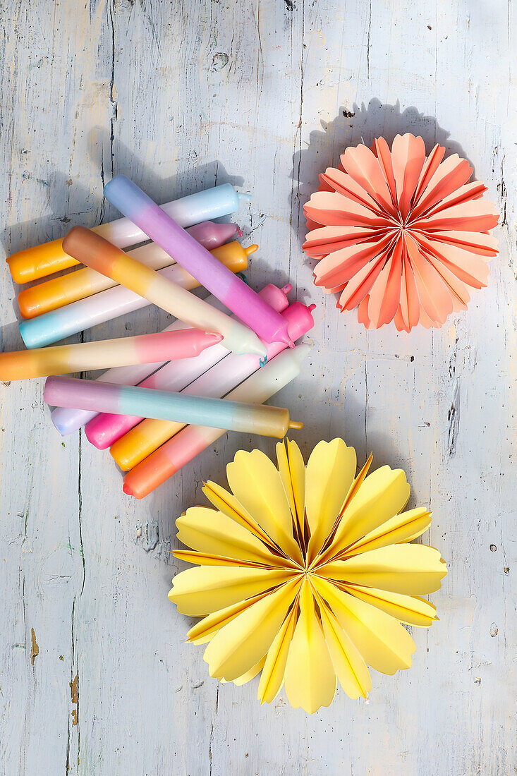 Colorful DIY candles and paper flowers