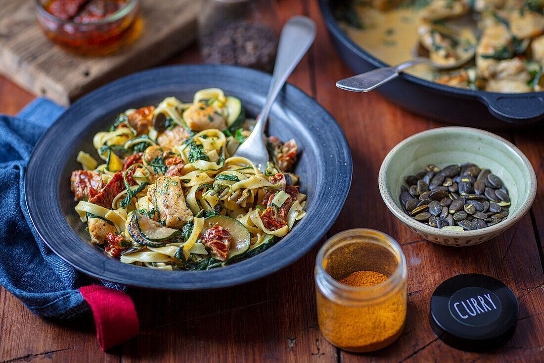 Tagliatelle with chicken, spinach, and dried tomatoes