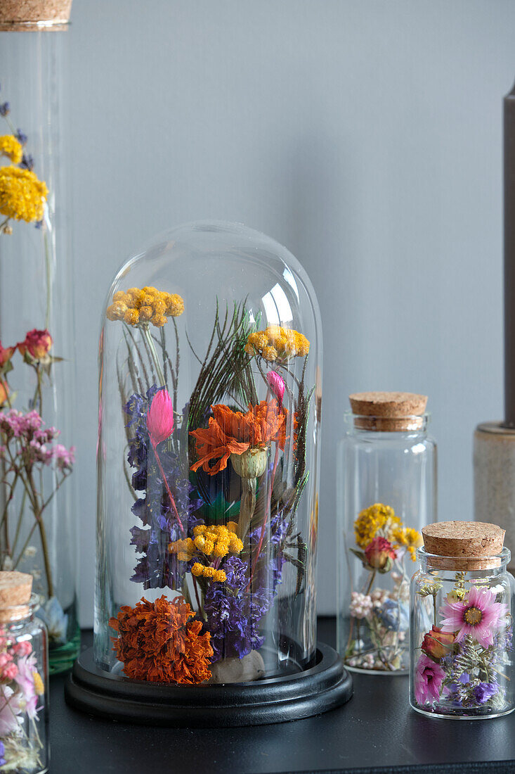 Dried flowers arrangement in glass stolp