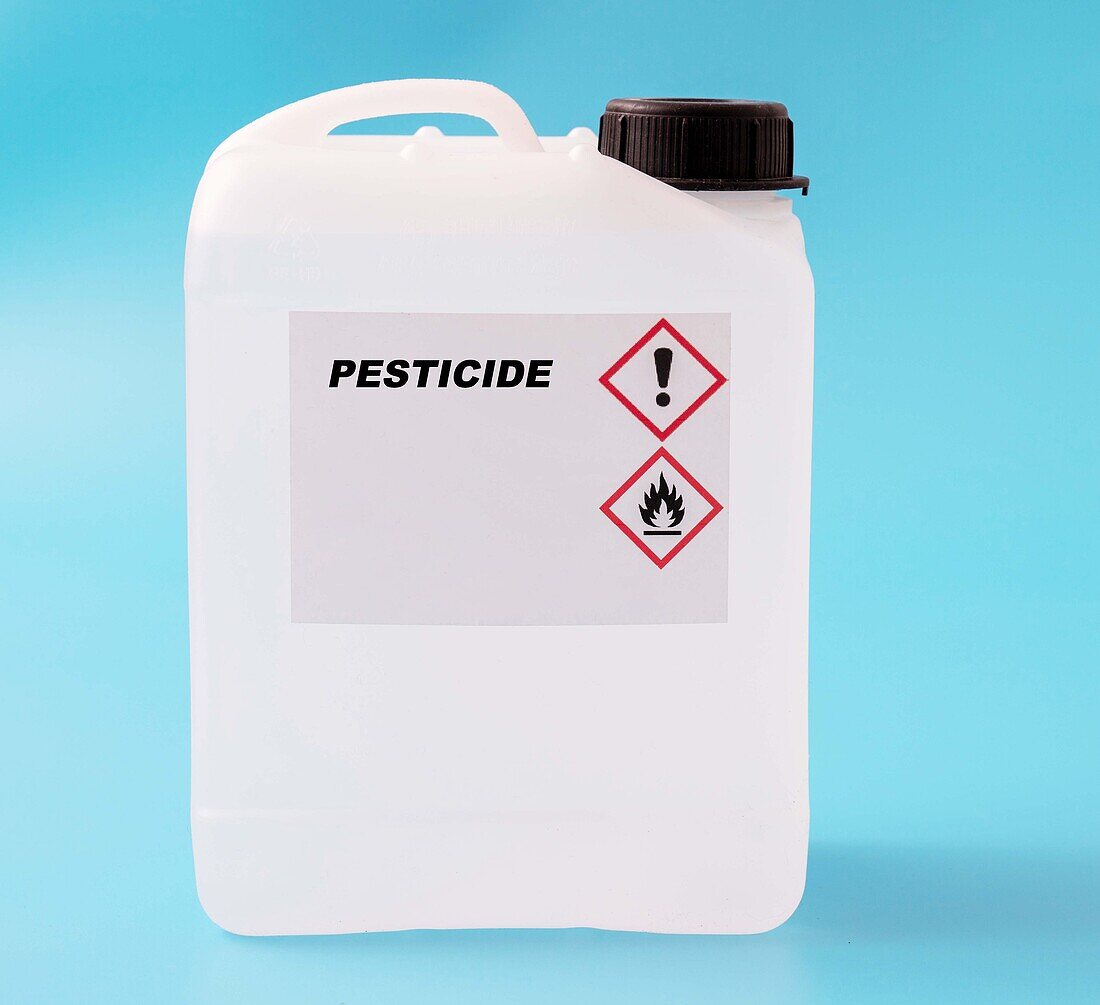 Pesticide in a plastic canister, conceptual image