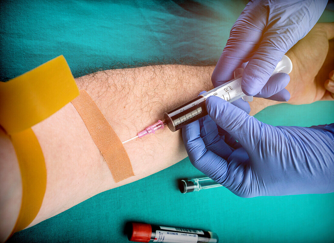 Nurse taking blood from a blood donor, conceptual image