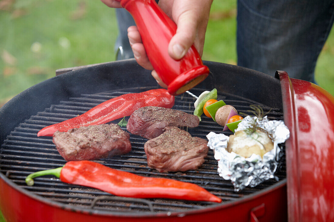 Grill with steaks and vegetables