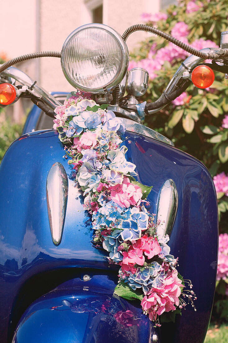 Motor scooter with hydrangea flower arrangement