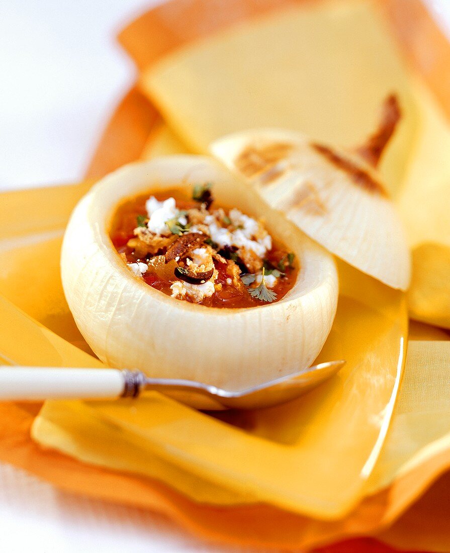 Spanish onion soup served in hollowed-out onion