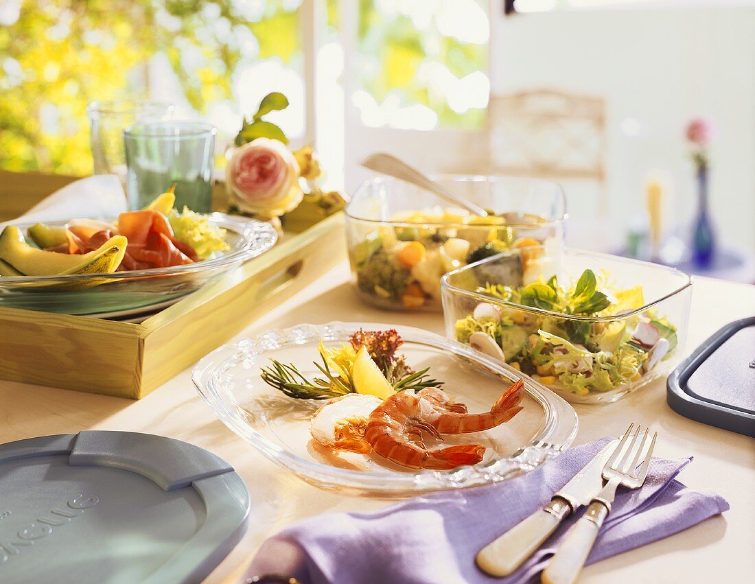 Appetisers: scampi, mixed salads, ham with melon