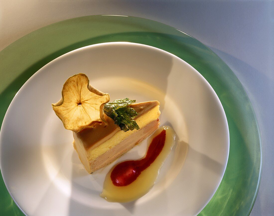 A piece of savoury goose liver cake on plate