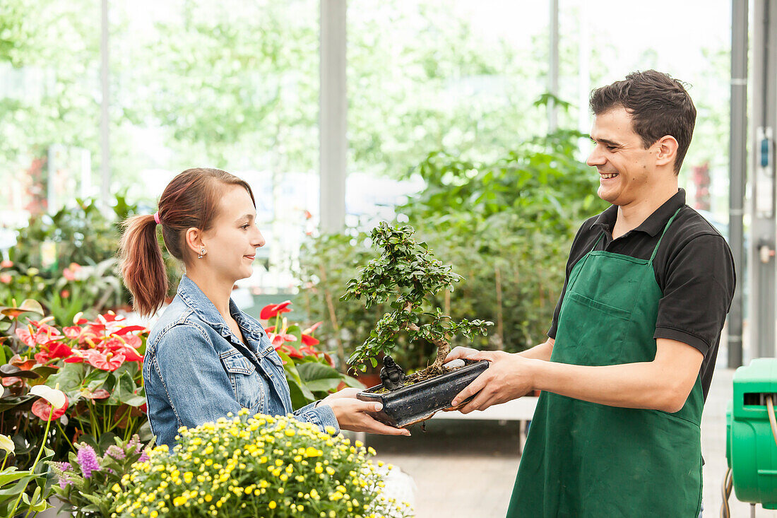 Garden centre salesman and customer