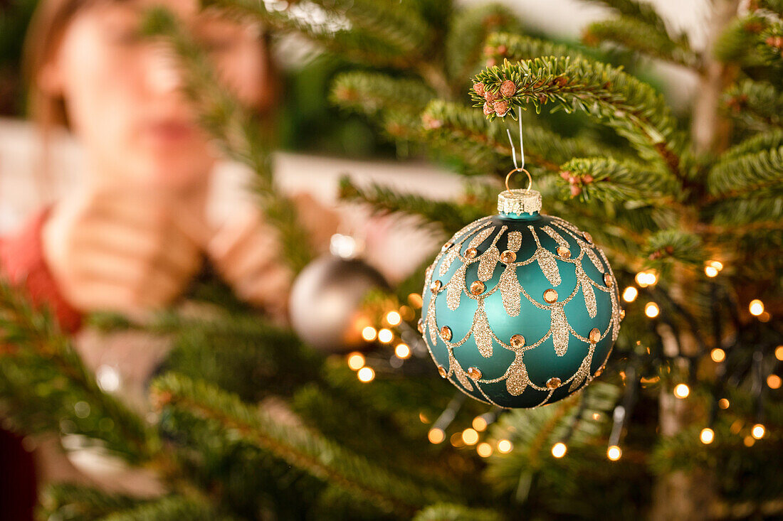 Hanging up Christmas baubles