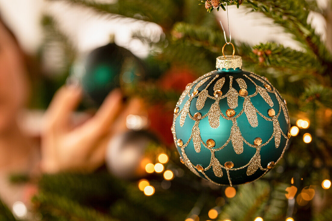 Hanging up the Christmas baubles