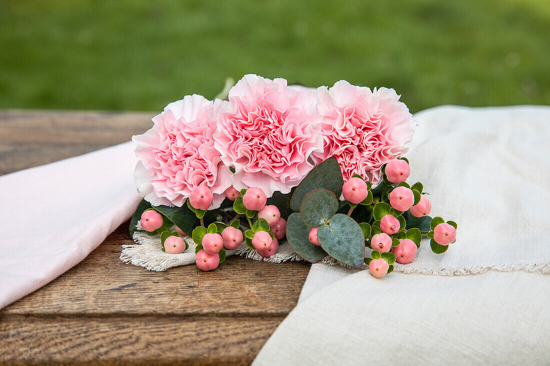 Cut flowers on a wooden background