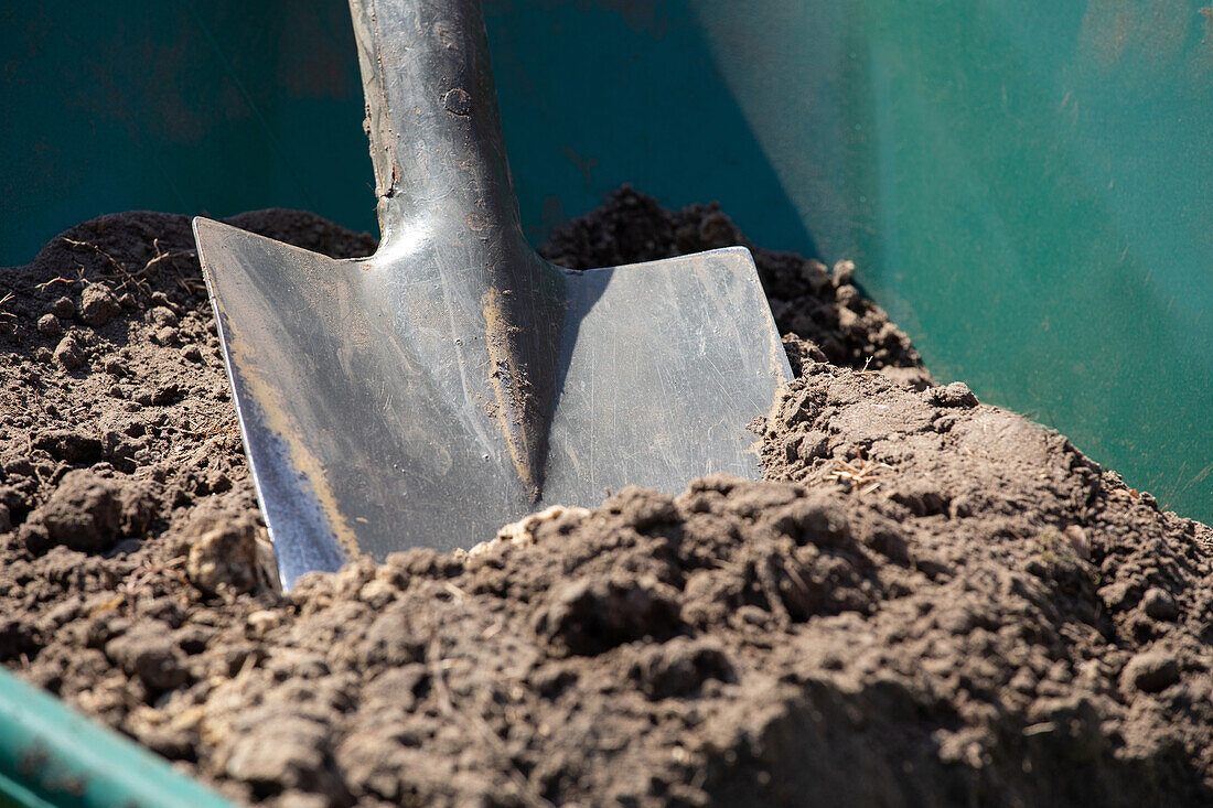 Wheelbarrow with shovel