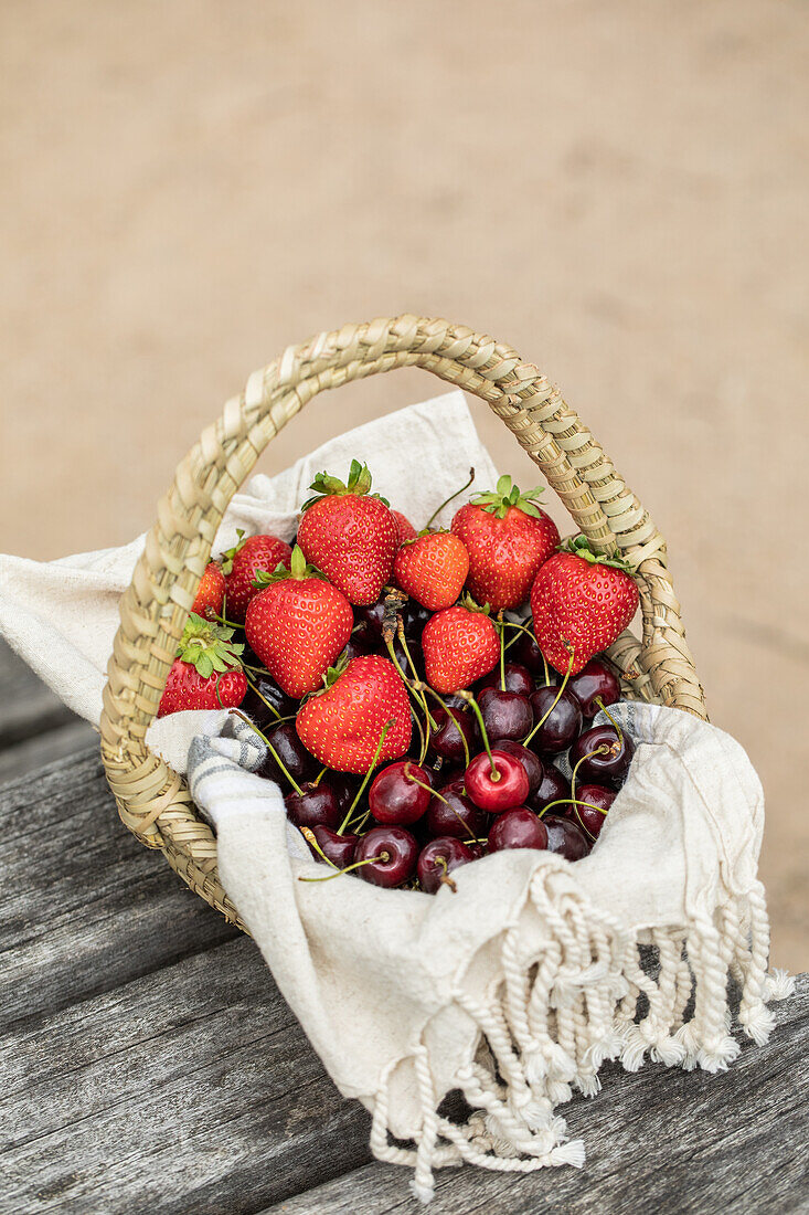 Basket with strawberries and cherries