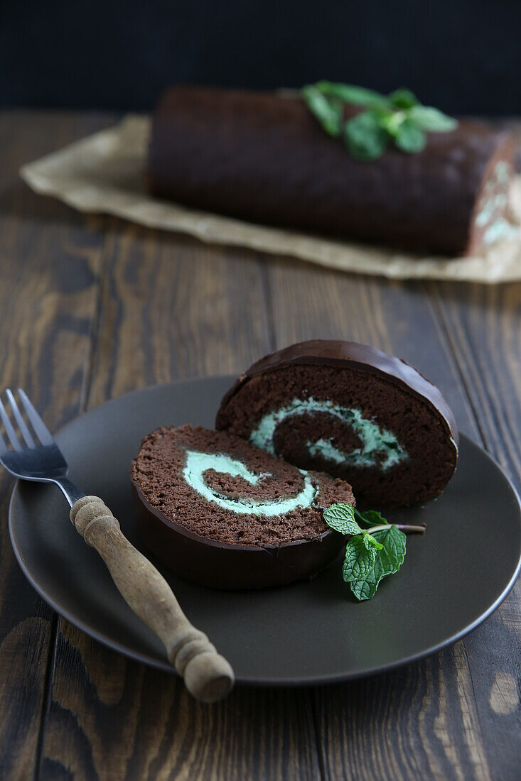 Chocolate sponge roll with mint cream and chocolate icing