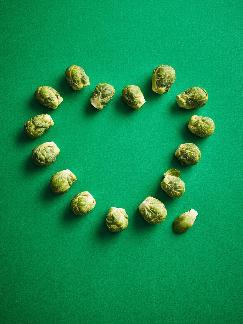 Brussels sprouts on a green background