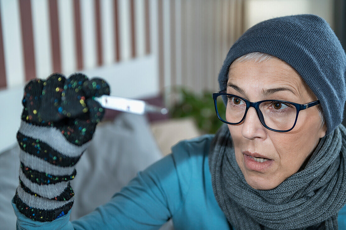 Woman measuring body temperature