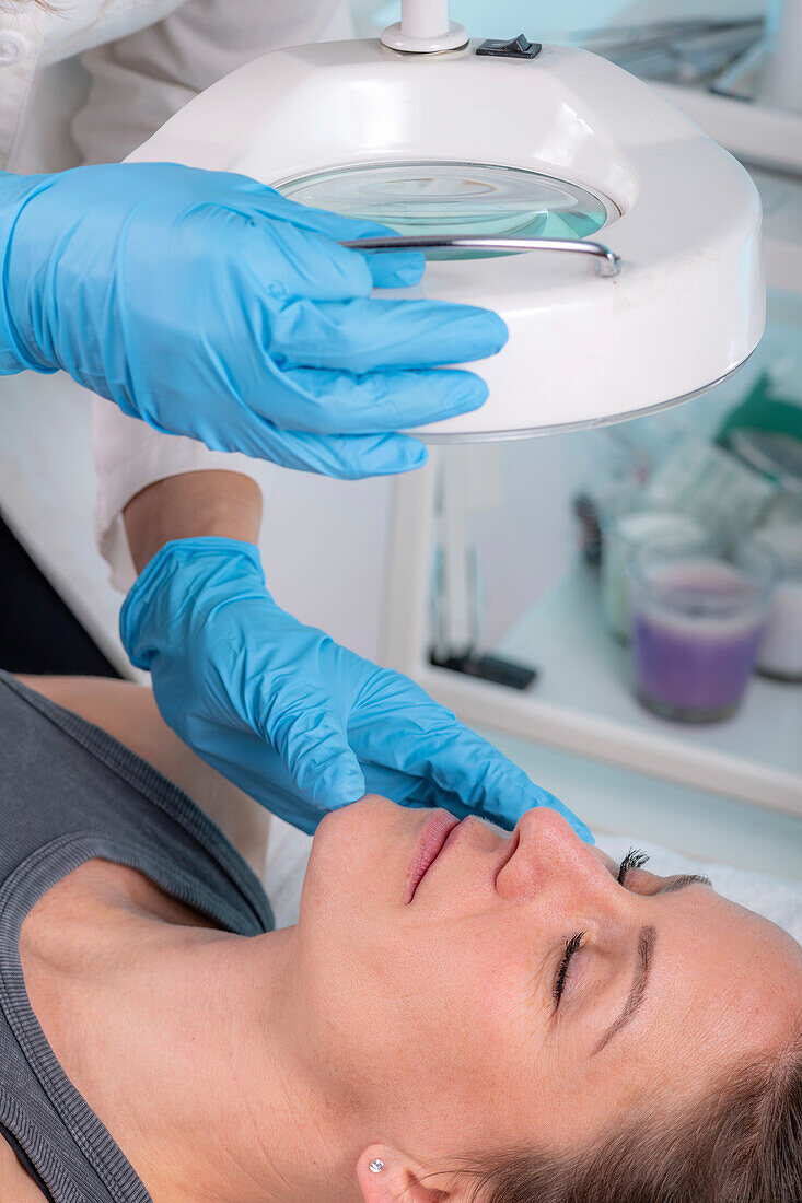 Dermatologist checking skin