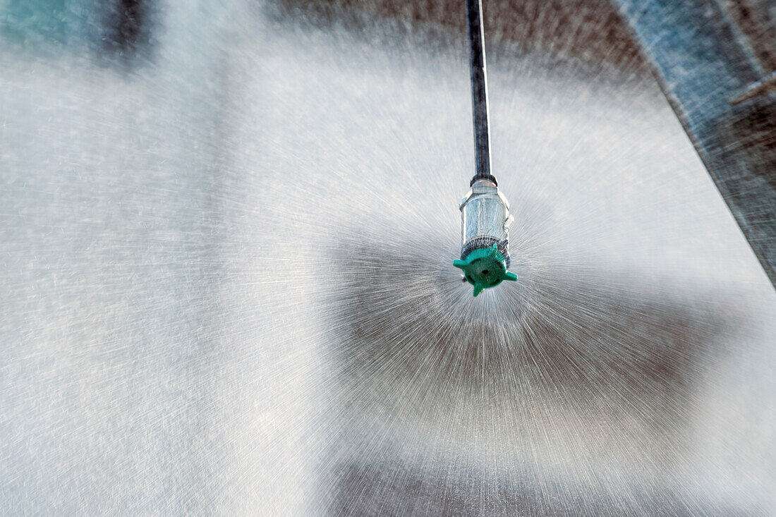 Agricultural sprinkler head spraying water