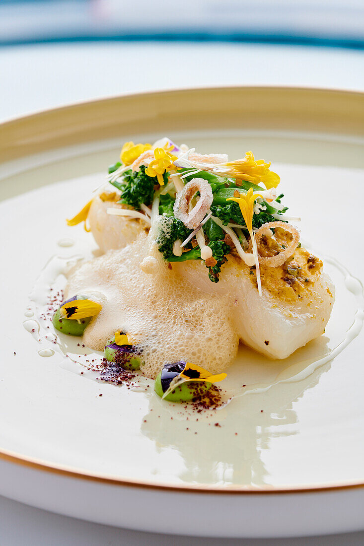 Turbot with vegetables and edible flowers