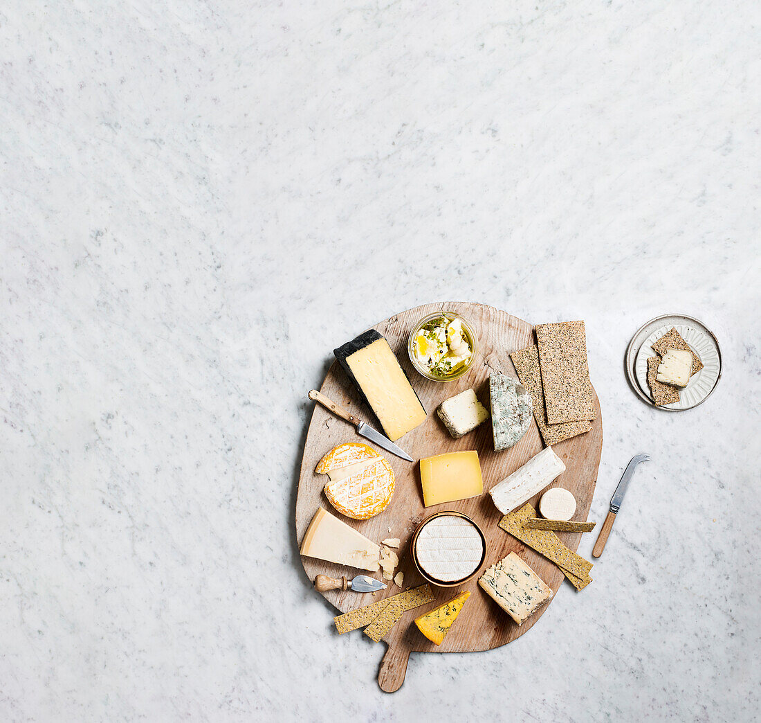 Various cheeses on a serving board
