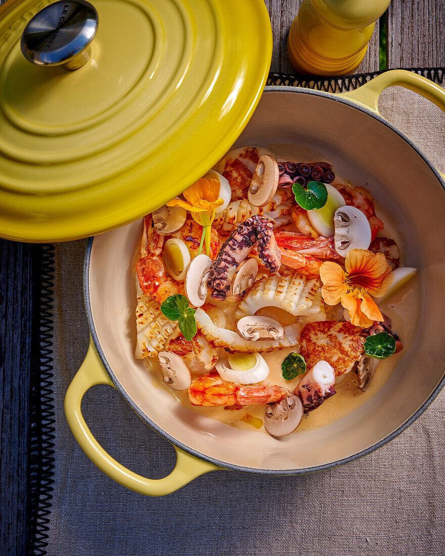 Seafood in cast iron pot with lid