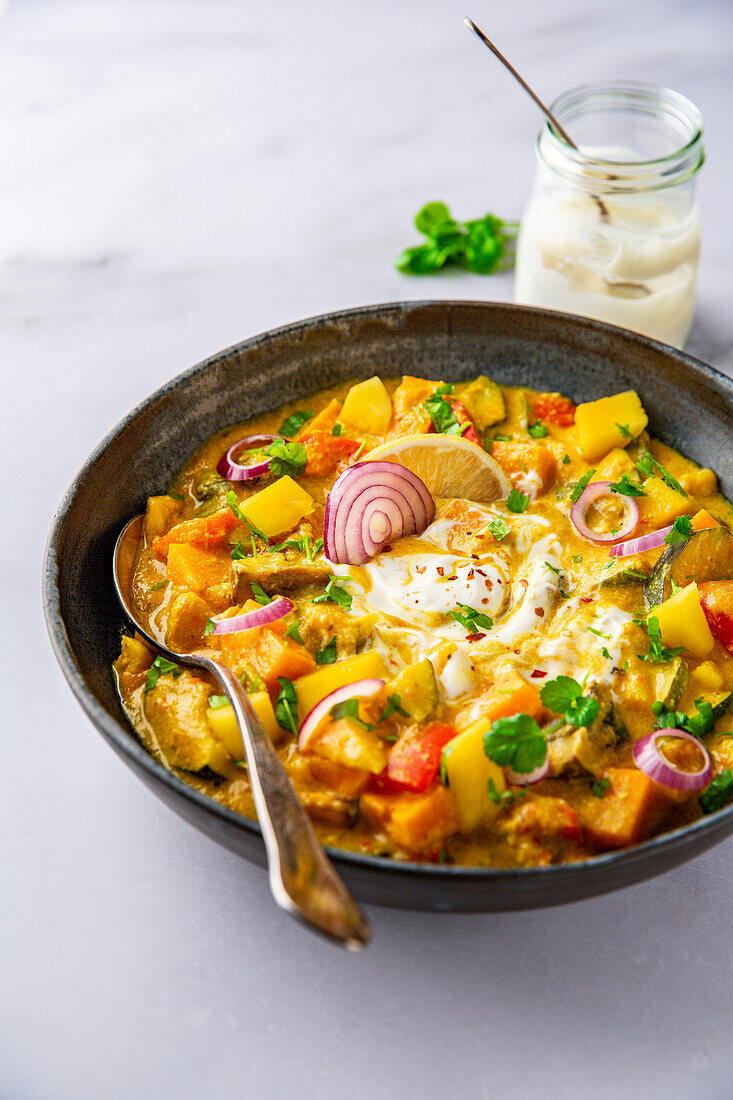 Oven curry with yoghurt and mango