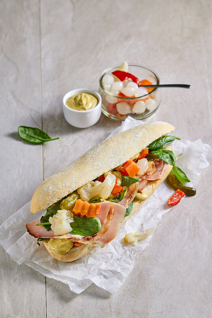 Sandwich with roast veal and pickled vegetables