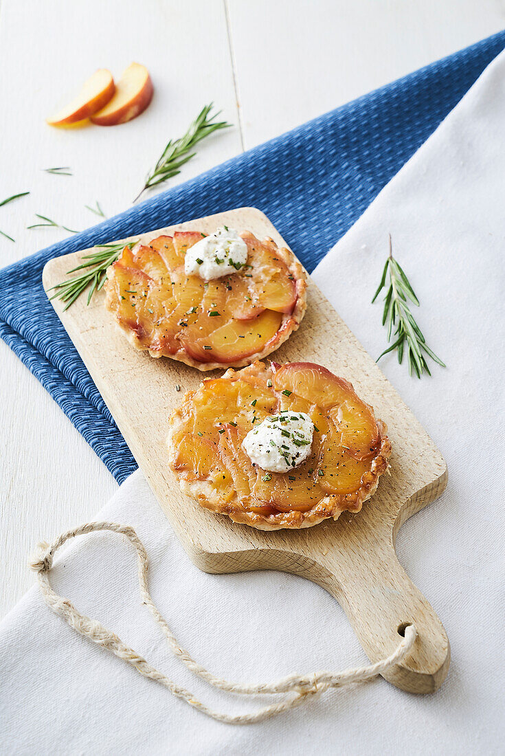 Small wholemeal tarte Tatins with peach and goat's cheese