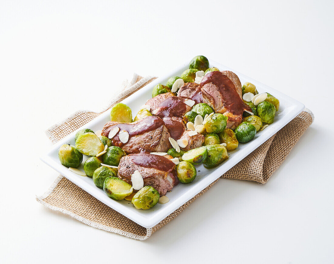 Pork fillet with barbecue sauce and Brussels sprouts