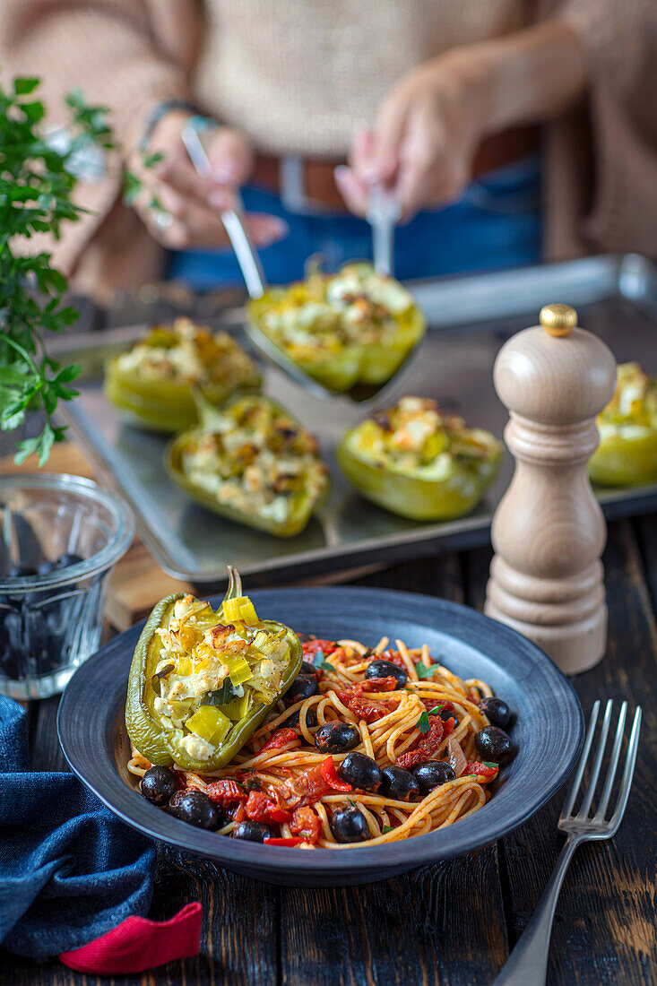 Tomato and olive pasta with stuffed green pepper