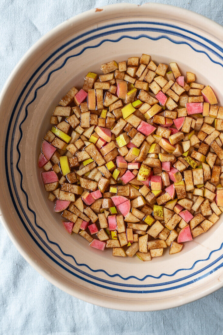 Chopped apple pieces in a bowl for preserving