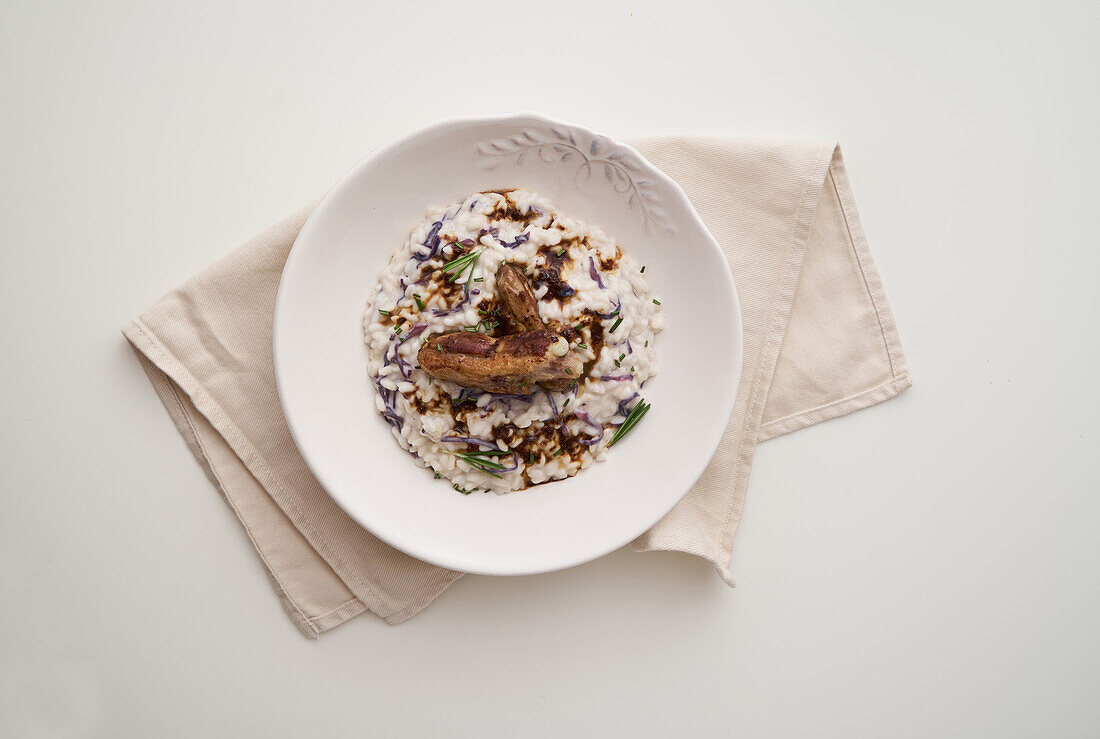 Risotto with red cabbage, pork ribs and rosemary