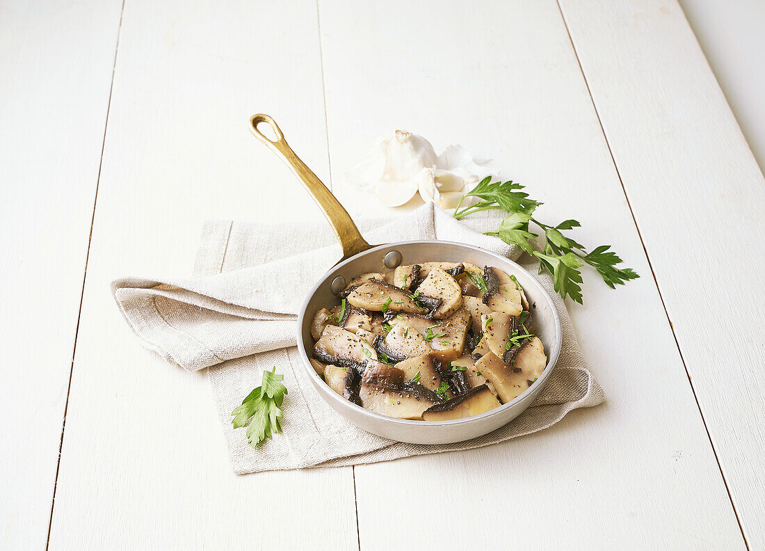 Fried portobello mushrooms in a pan